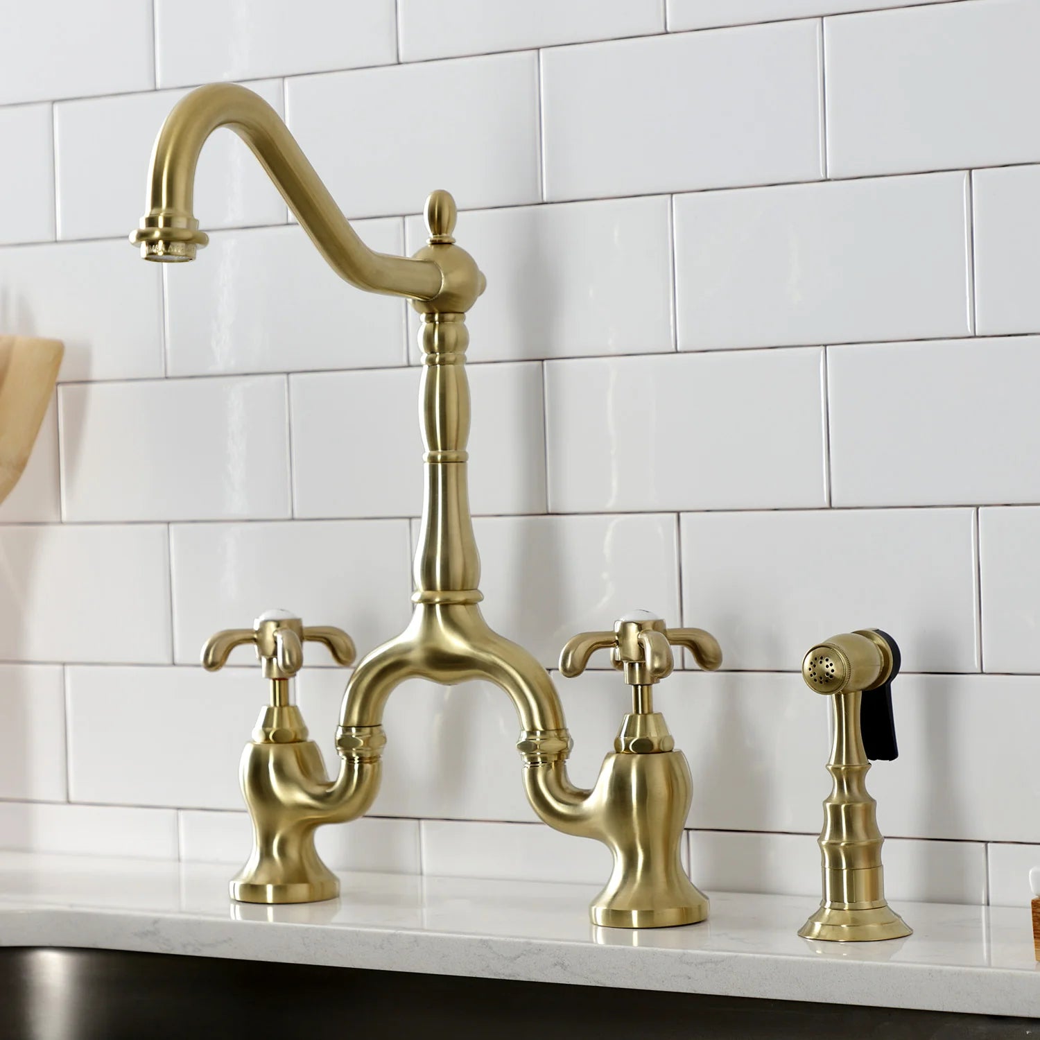 Kingston Brass Heirloom French Country Two-Handle 3-Hole Deck Mount Bridge Kitchen Faucet with Brass Sprayer
