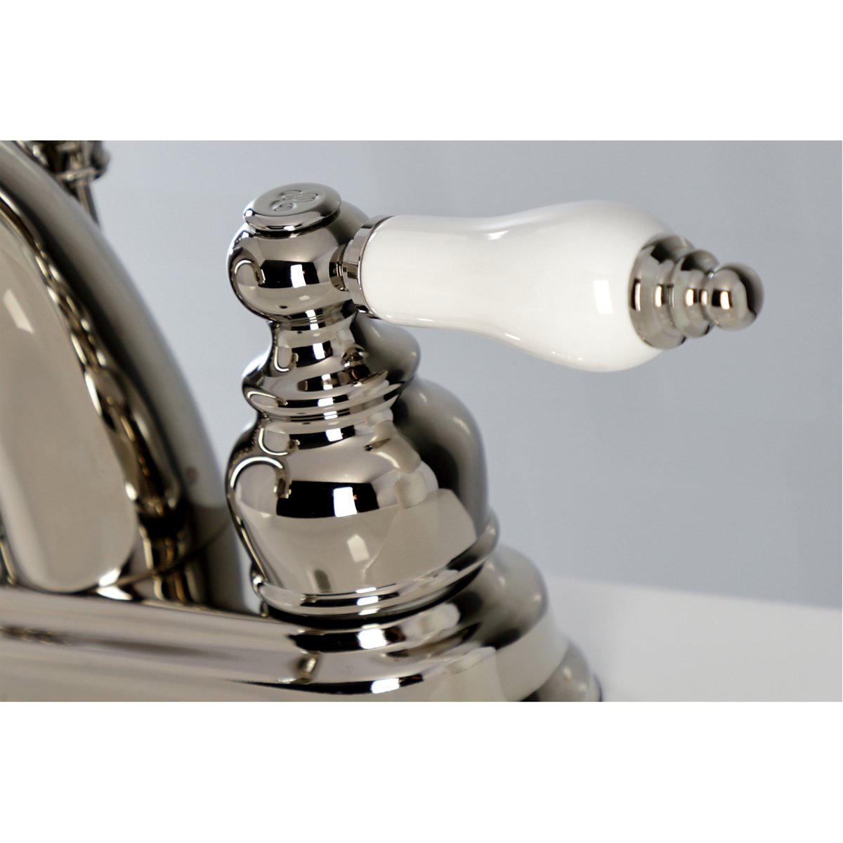 Kingston Brass Restoration Deck Mount 4-Inch Centerset Bathroom Faucet