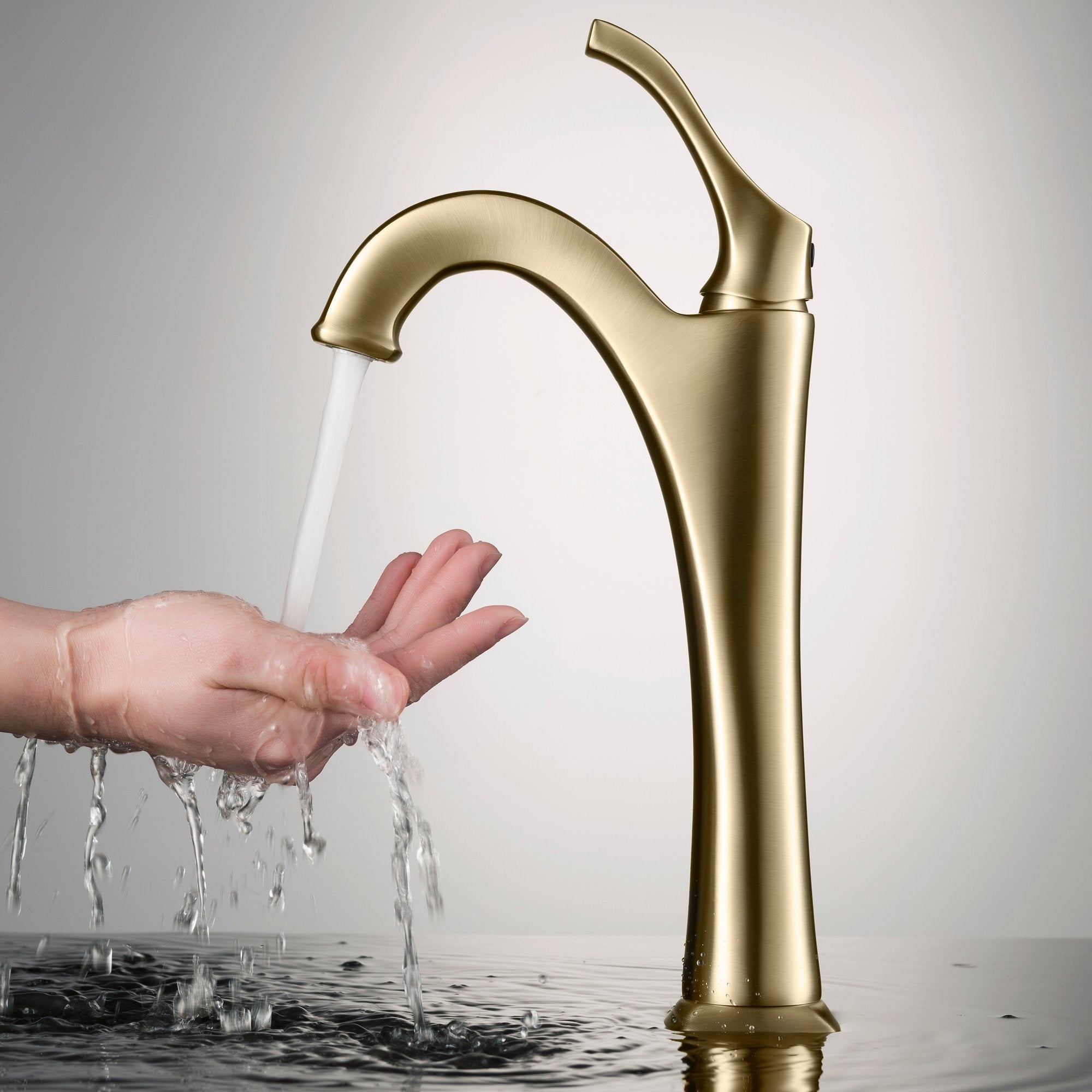 https://directsinks.com/cdn/shop/products/KRAUS-Arlo-Brushed-Gold-Tall-Vessel-Bathroom-Faucet-with-Pop-Up-Drain_2000x2000.jpg?v=1664245689
