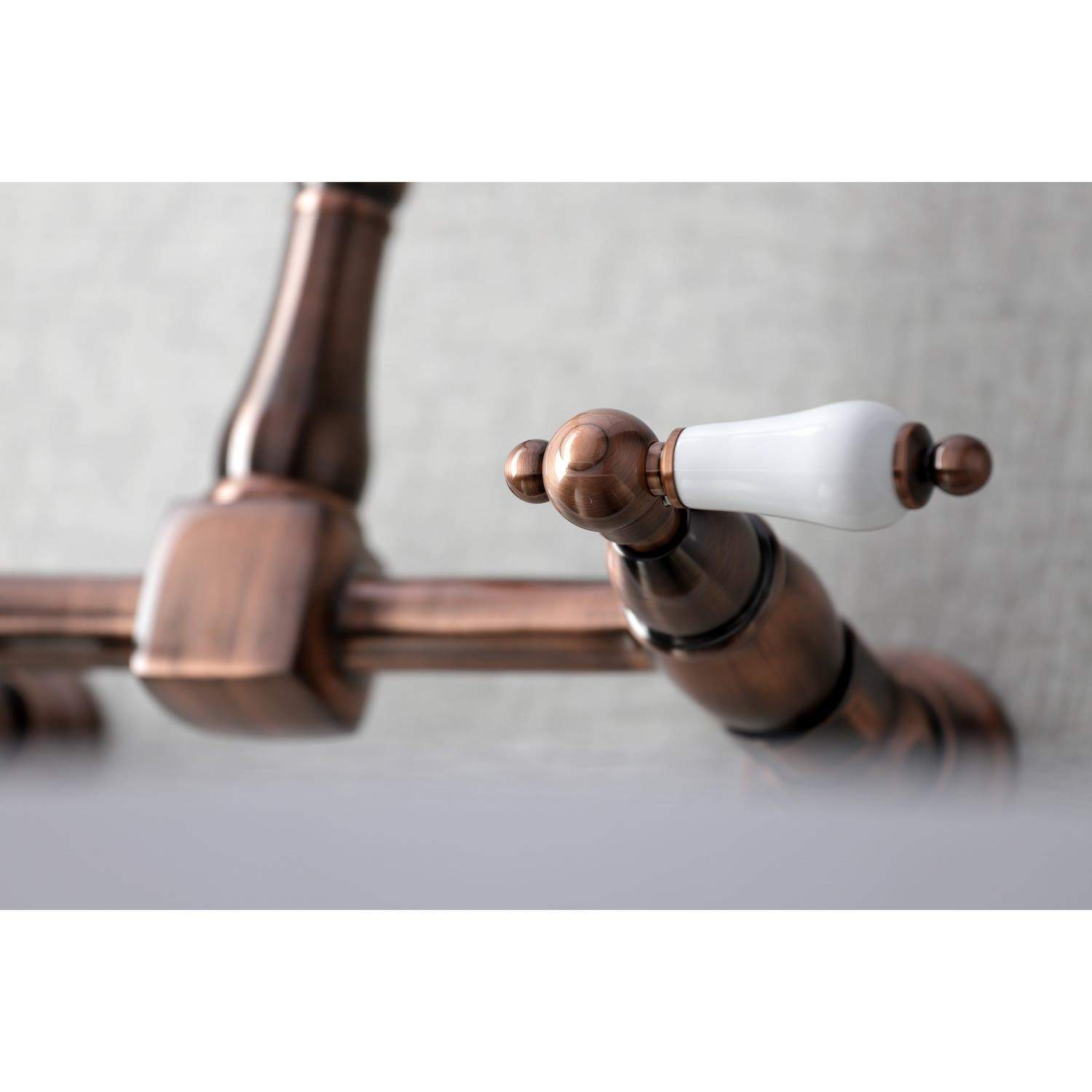 Kingston Brass KS124PLAC Heritage Two-Handle Wall Mount Bridge Kitchen Faucet, Antique Copper