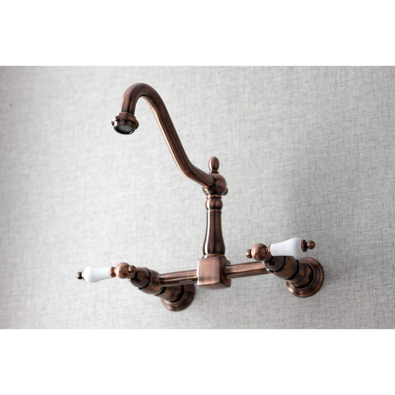 Kingston Brass KS124PLAC Heritage Two-Handle Wall Mount Bridge Kitchen Faucet, Antique Copper